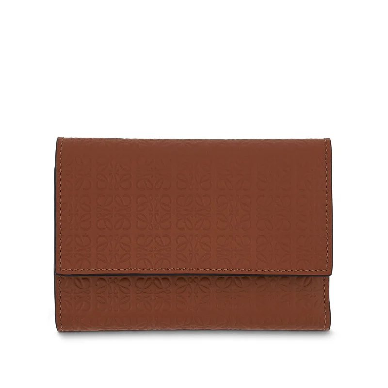 women's wallet with practical features -Repeat Small Vertical Wallet in Embossed Calfskin in Tan