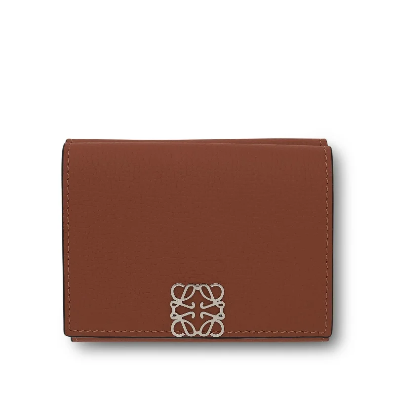 women's wallet with elegant design details -Anagram Trifold Wallet Pebble Grain Calfskin in Tan