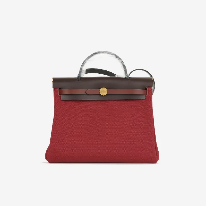 women's handbag with metallic hardware details -Hermès Hermes - Herbag 31 - Rouge Grenat Canvas / Rouge Sellier / Rouge H / Noir Hunter GHW - Brand New