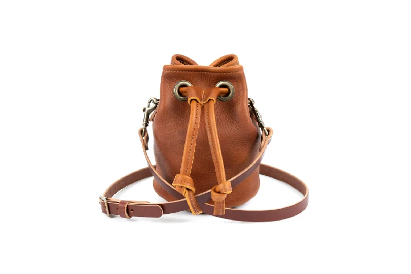 women's bucket bag with classic silhouette -LEATHER BUCKET BAG - SMALL - SADDLE