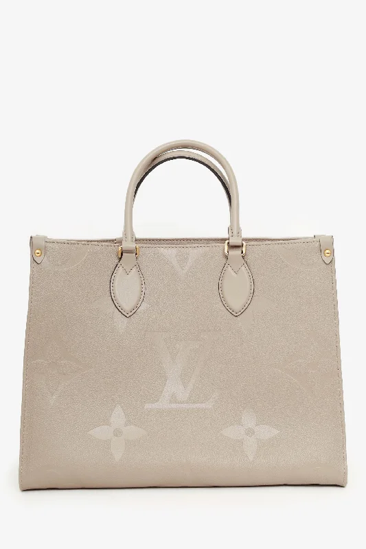 women's handbag with luxe finish -Louis Vuitton Turtledove Monogram Empreinte Leather OnTheGo MM Tote