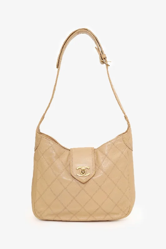 women's handbag with contrasting color interior -Pre-Loved Chanel™ 1986-88 Beige Quilted Lambskin CC Hobo Shoulder Bag with Pouch