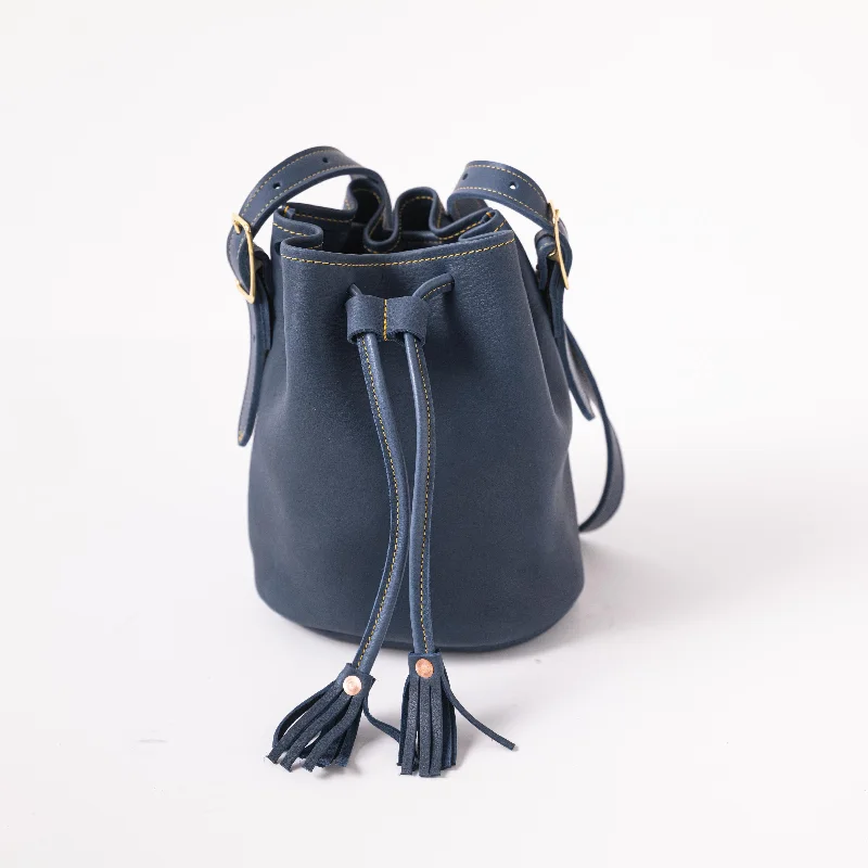 women's bucket bag with faux-leather finish -Blue Cypress Bucket Bag